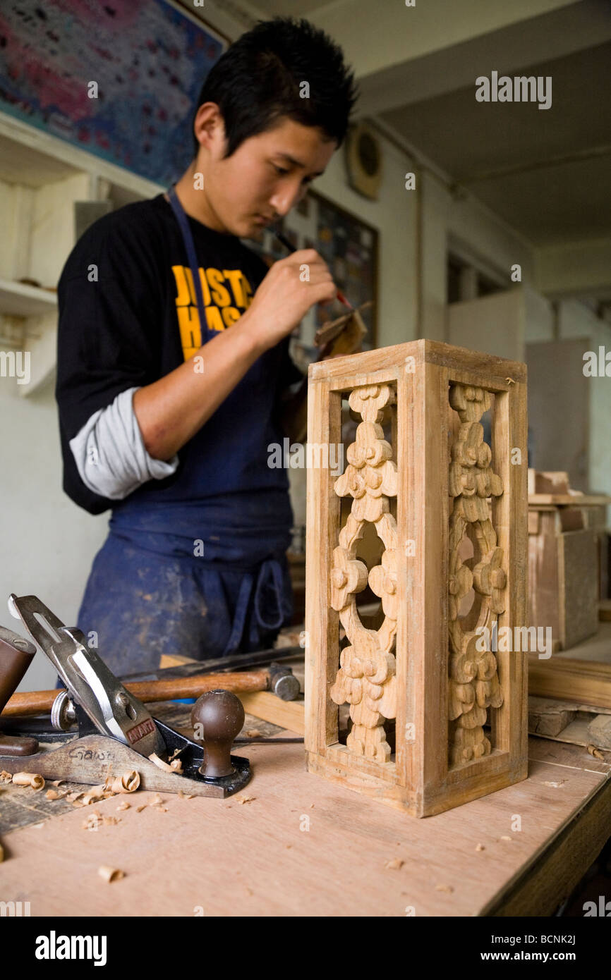 Tibetan refugee working in the woodworking workshop at the Norbulingka Institute. Sidhpur, Dharamsala. Himachal Pradesh. India. Stock Photo