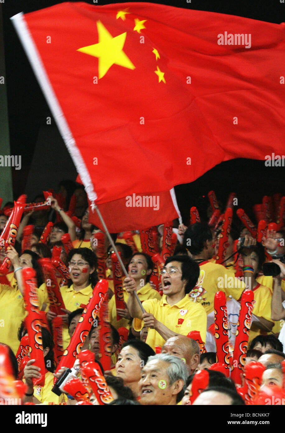 Fans in the audience waving flag of People's Republic of China, Beijing, China Stock Photo