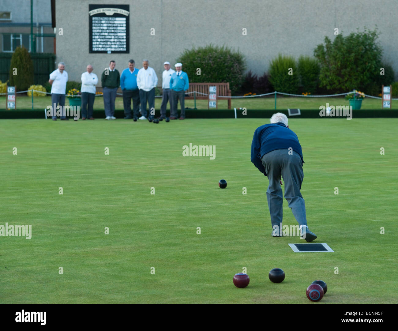 Game of bowls at Kelso Bowling Club on a summer evening in Scotland Stock Photo