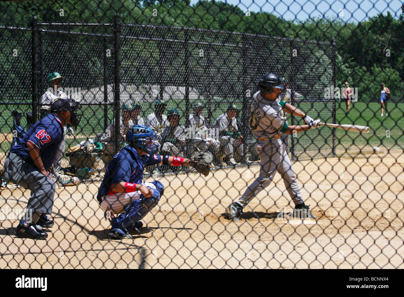 Advertising poster for amateur baseball game shows batter and catcher at  home plate Stock Photo - Alamy