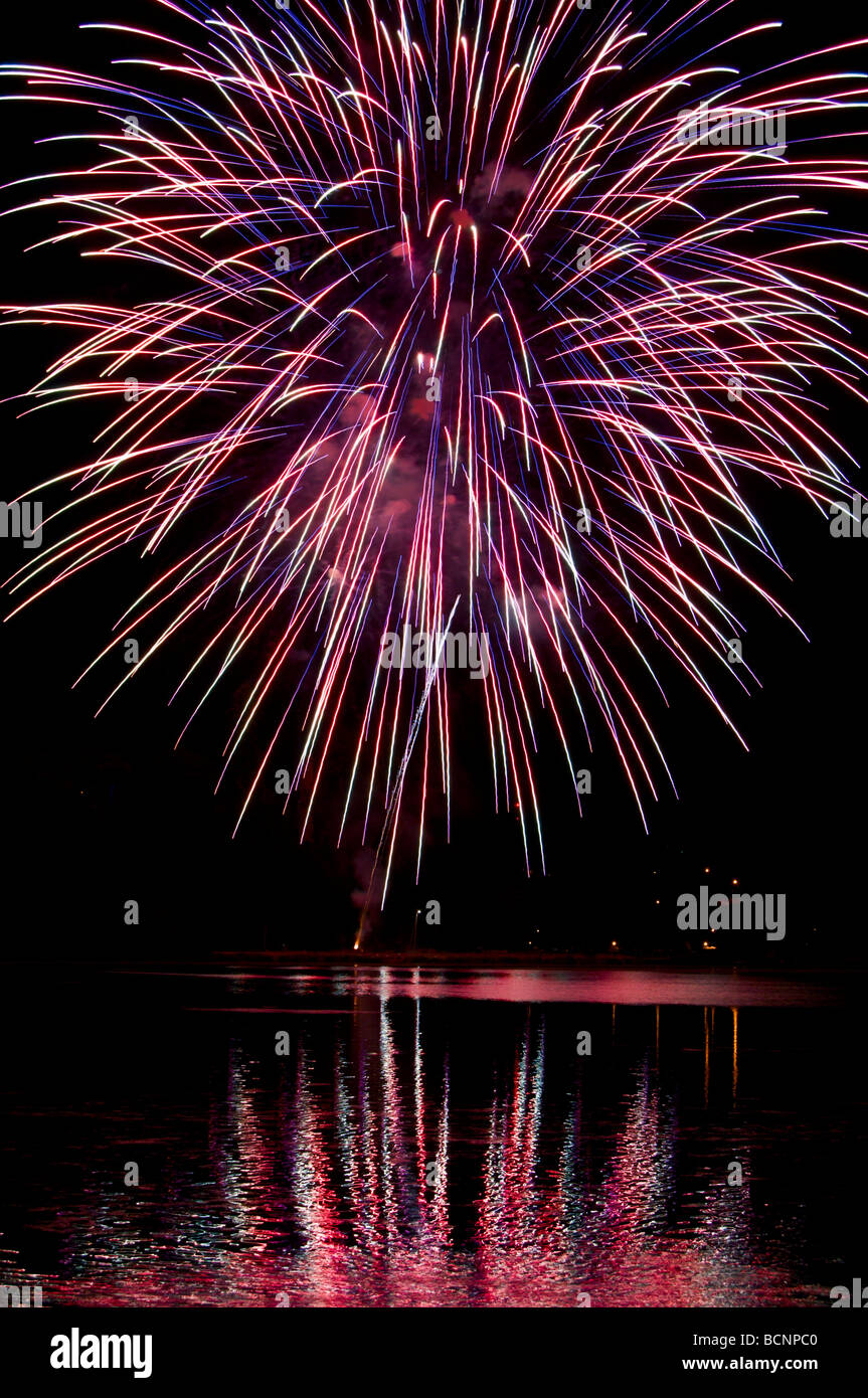 Spectacular fireworks explode over Capitol Lake in Olympia Washington during the Lakefair celebration. Stock Photo