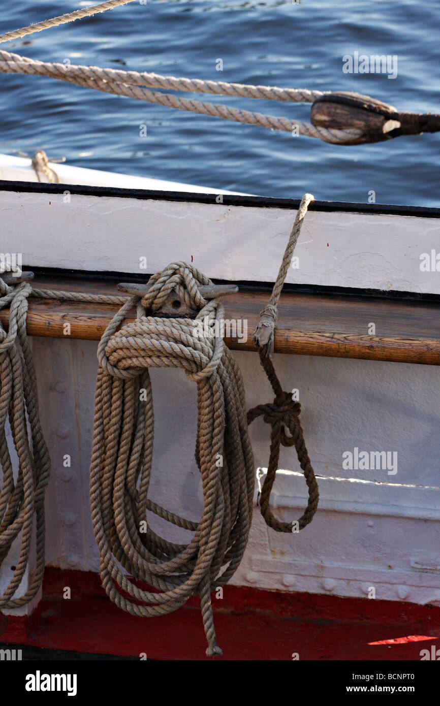 Coiled Rope tied to a cleat onboard a ship Stock Photo - Alamy