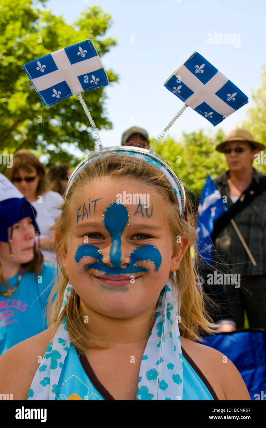 Portrait of a girl with the fleur de lys symbol on her face during Saint  Jean Baptiste parade Montreal Quebec Stock Photo - Alamy