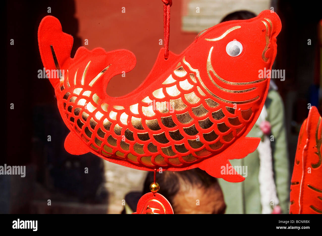 Large red carp shaped Chinese knot ornament sold in Dongyue Temple Fair during Spring Festival, Beijing, China Stock Photo