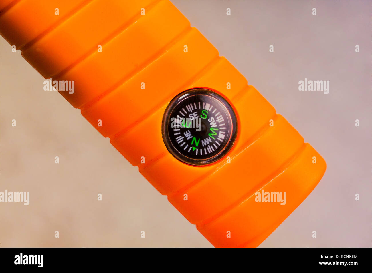 A tennis racquet handle set with a compass Stock Photo - Alamy