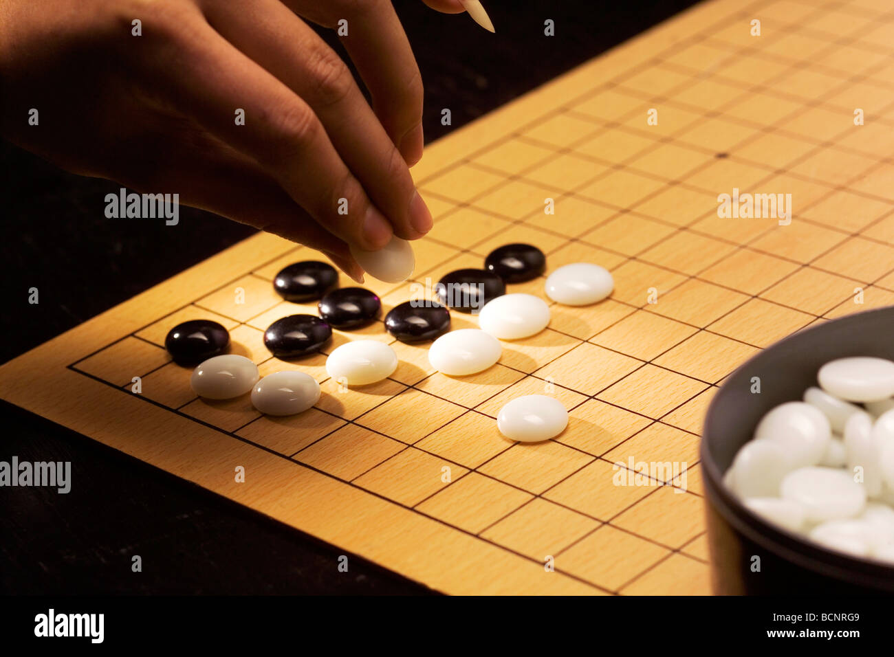 Playing Weiqi game Stock Photo