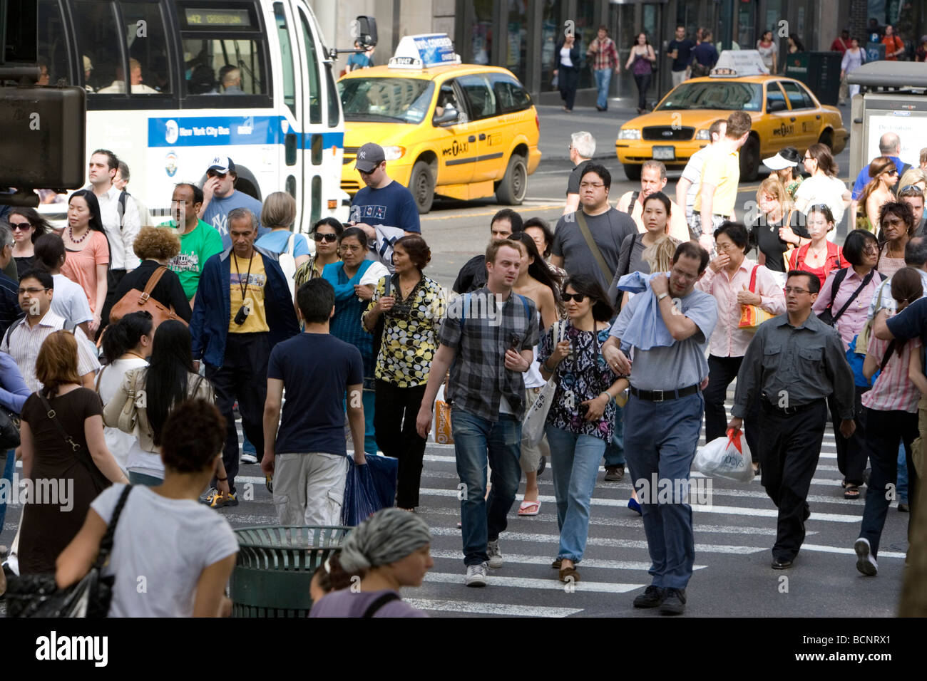 Midtown Manhattan is always crowded with office workers shoppers and tourists Stock Photo