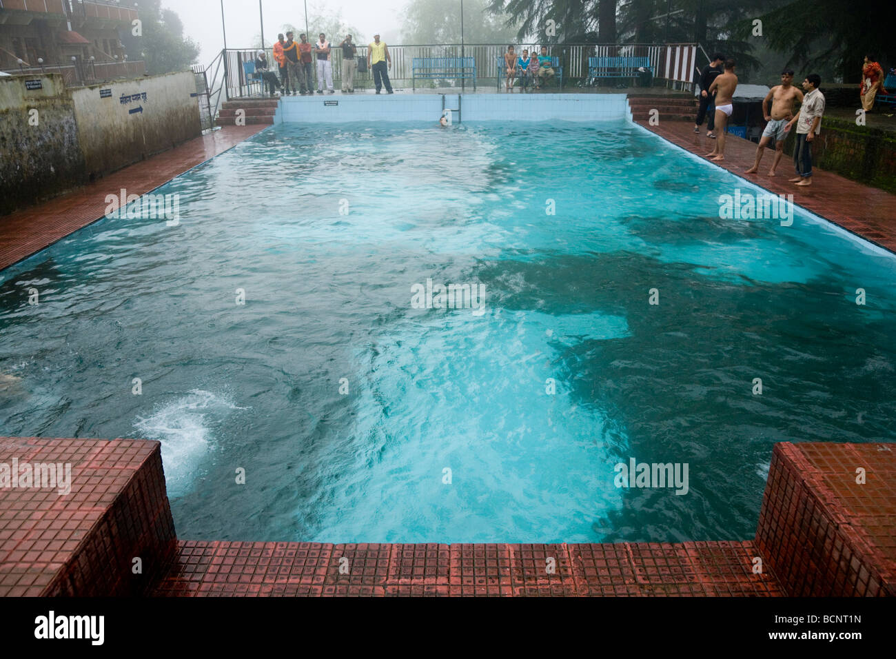 The outdoor swimming pool at Bhagsu, near McLeod Ganj. Dharamsala. India. There is algae growth on the floor. Stock Photo
