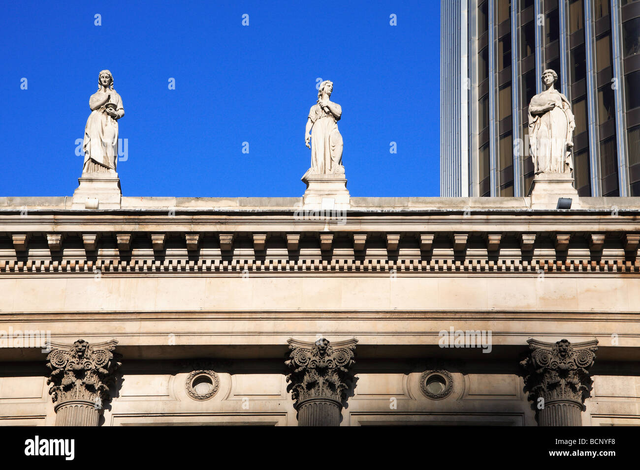 Statues on Gibson Hall and tower 42 former Natwest Tower building City of London England UK Stock Photo