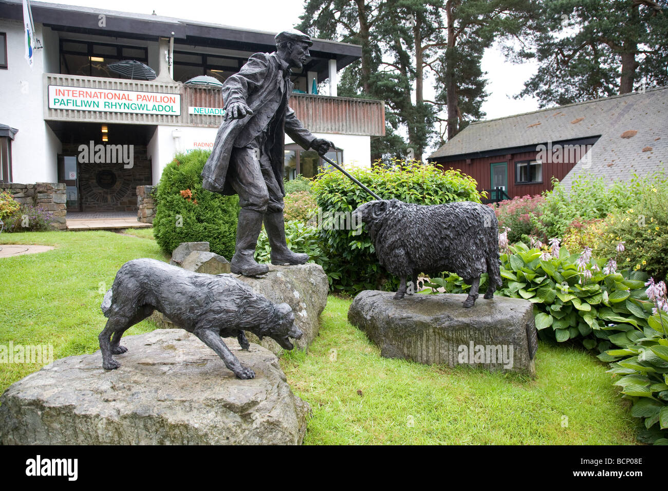 Sculpture of A Welsh Shepherd, his sheepdog and a sheep at the International Visitor's Pavilion of the Royal Welsh showground. Stock Photo
