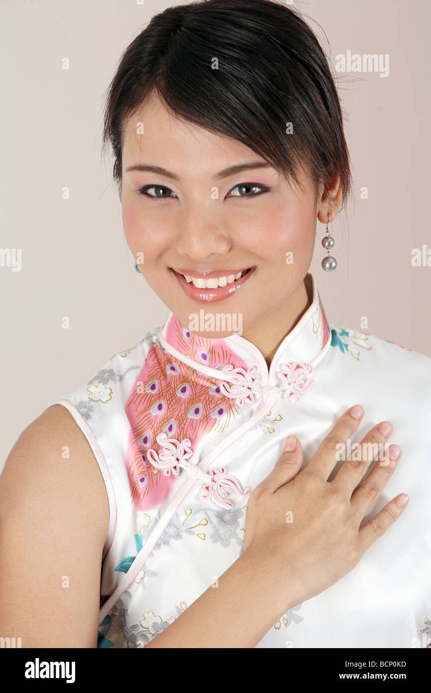 chinese woman with hand gesture welcome Stock Photo