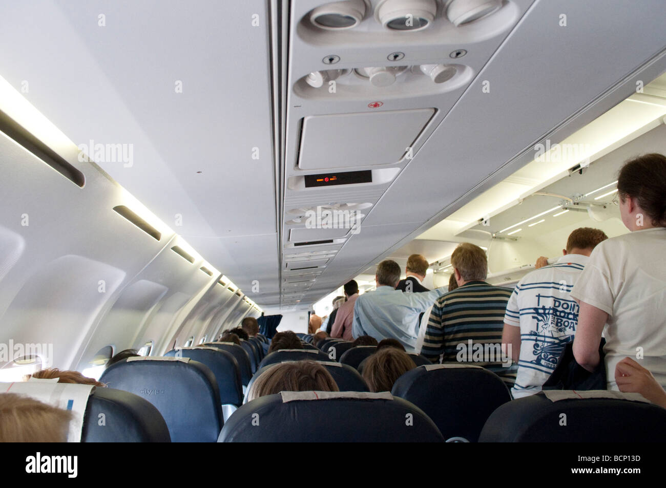 Passengers leave a flight due to delays before take off disembarkment ...