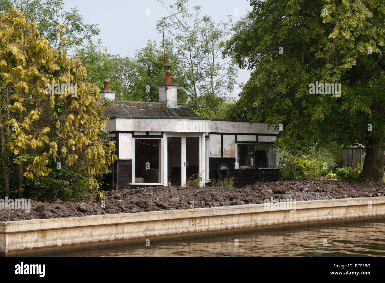 semi derelict waterside home Norfolk broads Stock Photo