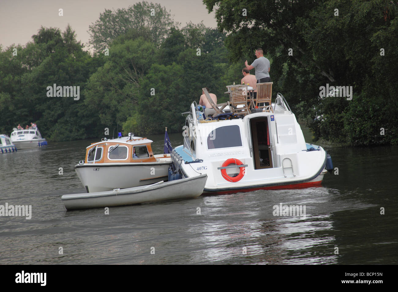 river police stopping cruiser on norfolk broads Stock Photo