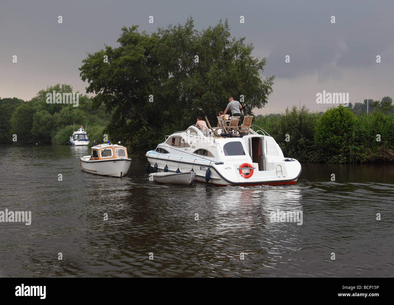 river police stopping cruiser on norfolk broads Stock Photo