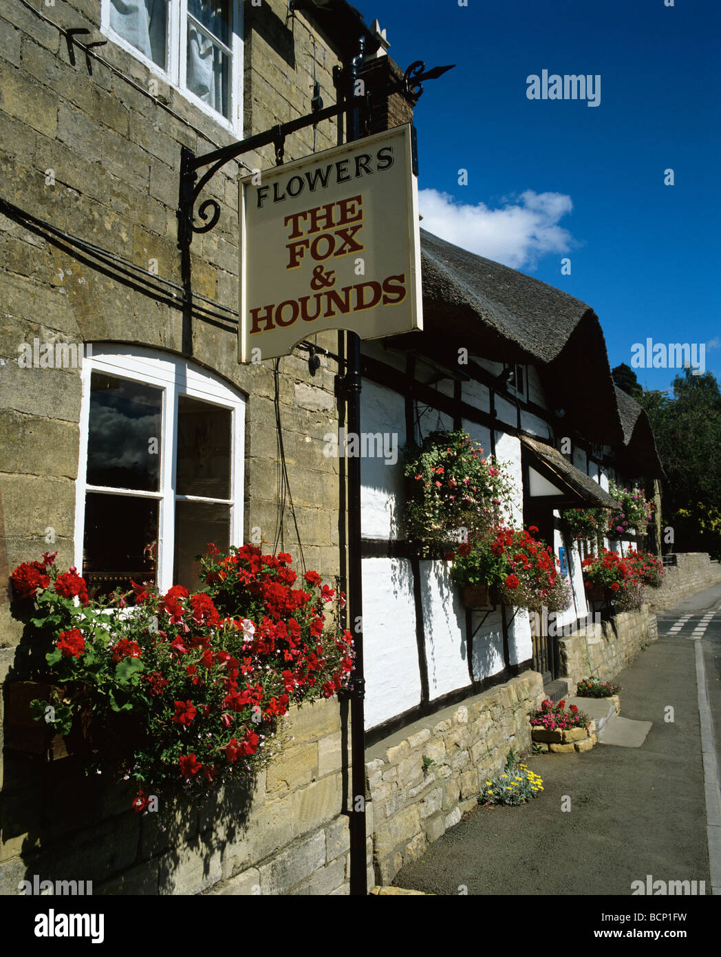 Street scene showing the Fox & Hounds Pub in the large village of