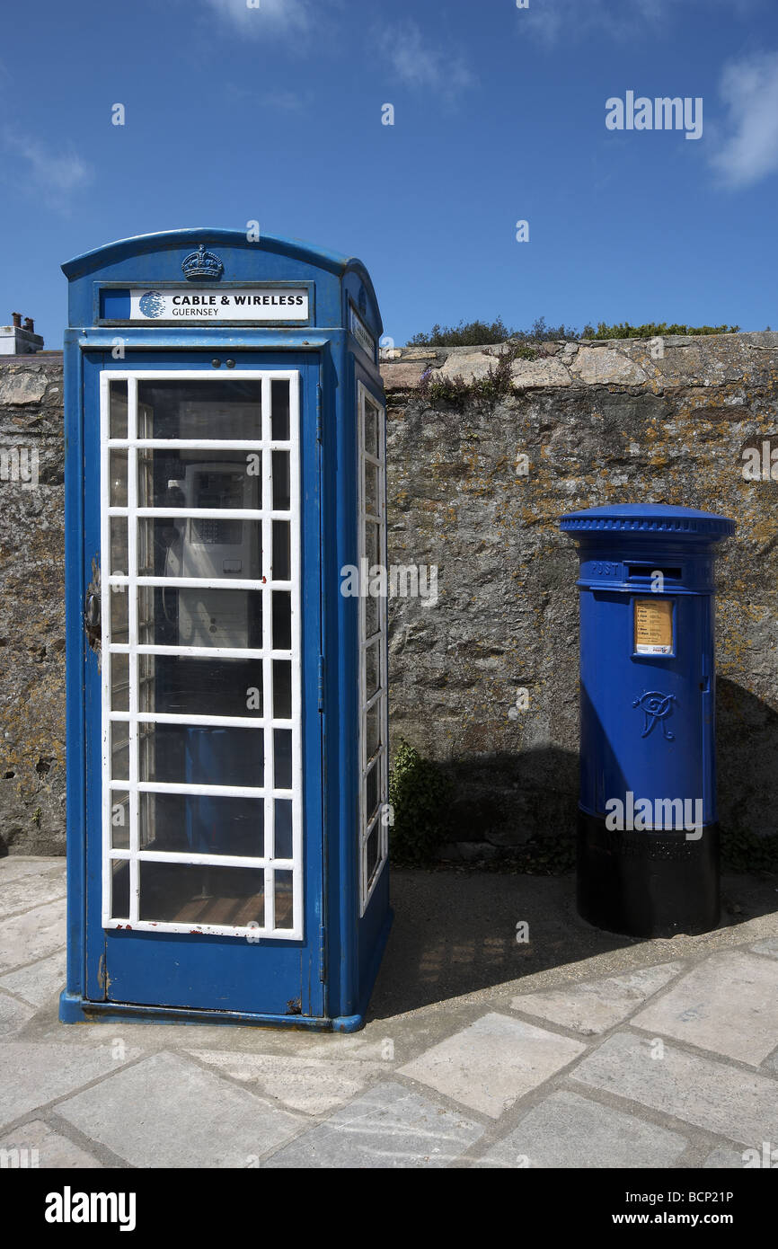 Blue telephone and post box St Anne Alderney Channel Islands UK Stock Photo