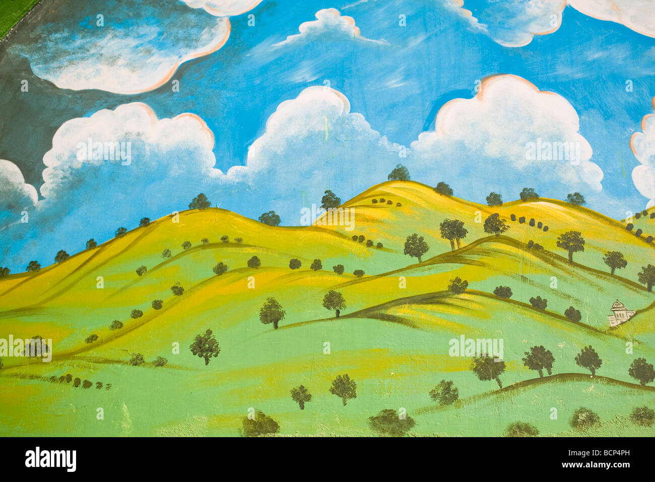 A painting on the side of a door in Udaipur in India s Rajasthan state picturing an ideal countryside Stock Photo