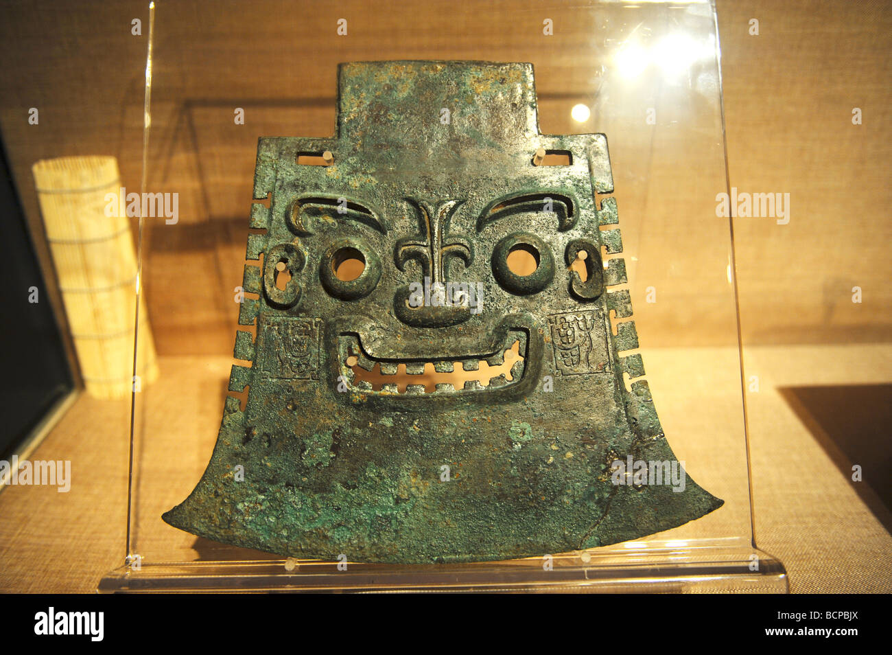 Bronze weapon axe Yue with human face design from Yachou in late Shang Dynasty, Capital Museum, Beijing, China Stock Photo