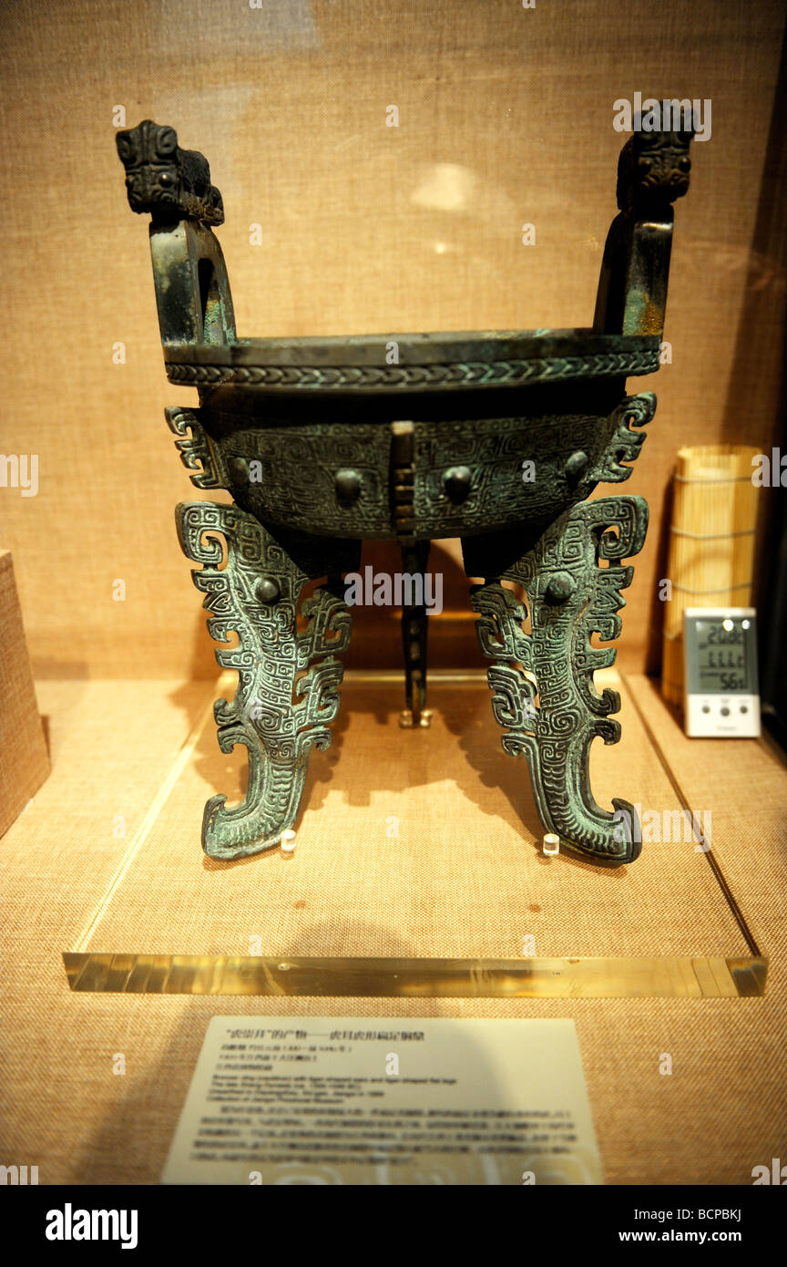 Bronze tripod ceremonial utensil decorated with tigers from late Shang Dynasty, Capital Museum, Beijing, China Stock Photo