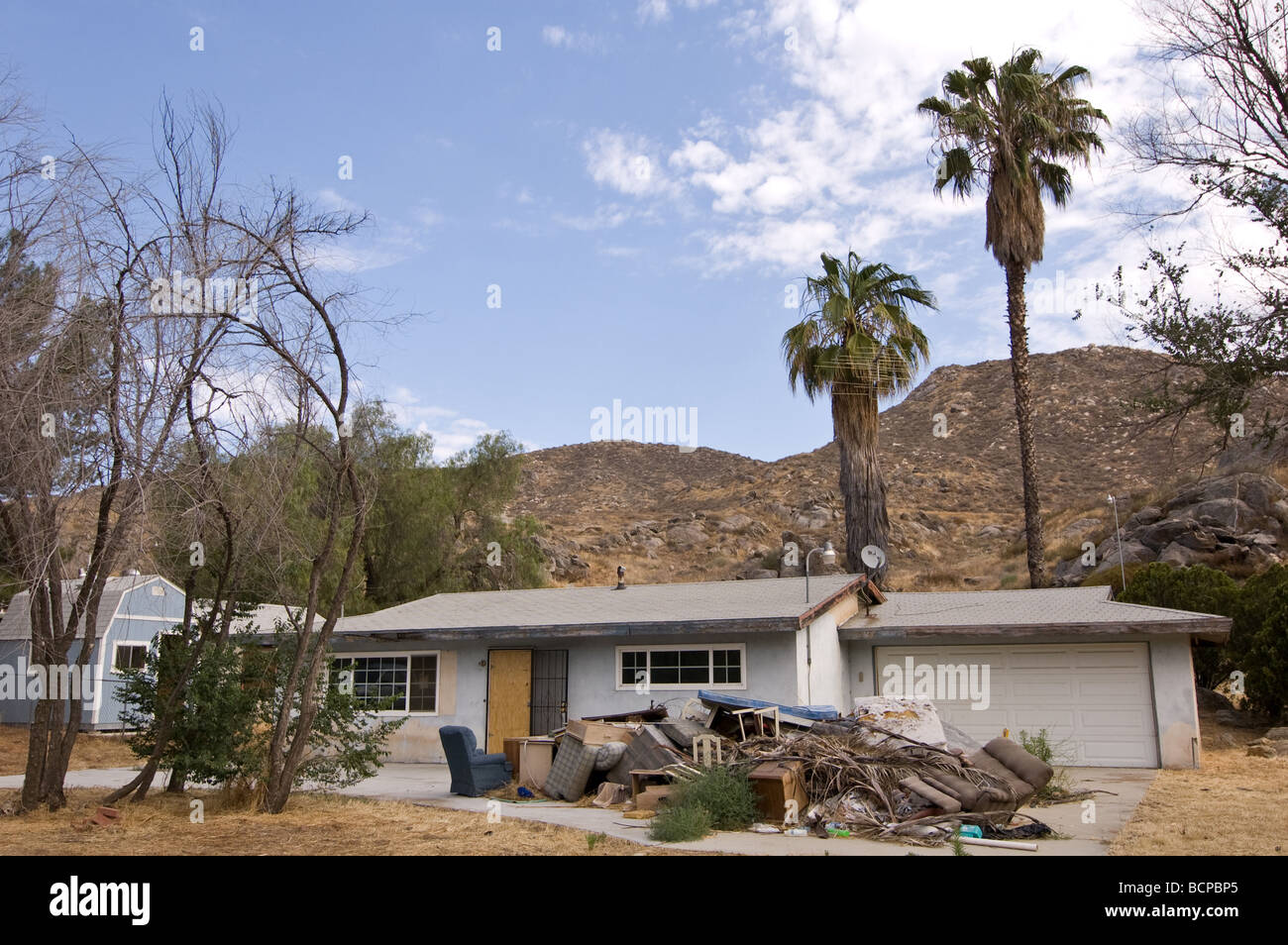 A boarded and abandoned home in the city of Hemet, California Stock
