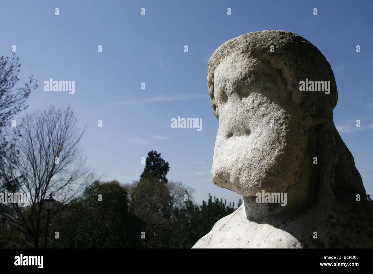 old worn damaged statue on ponte fabricio bridge in rome italy Stock