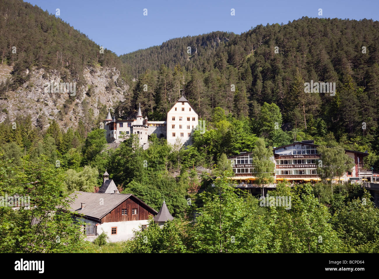 Nassereith Tyrol Austria Schloss Fernsteinsee Castle hotel in Fernpass on the mountainside of the Lechtal Alps in summer Stock Photo