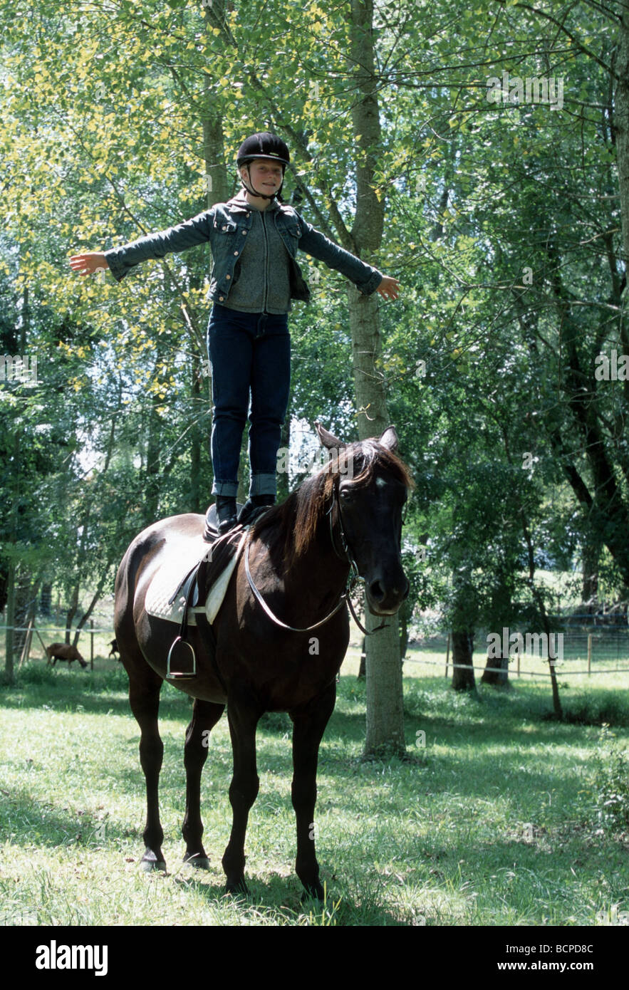 Child stunts on horse back  - SerieCVS500200a Stock Photo