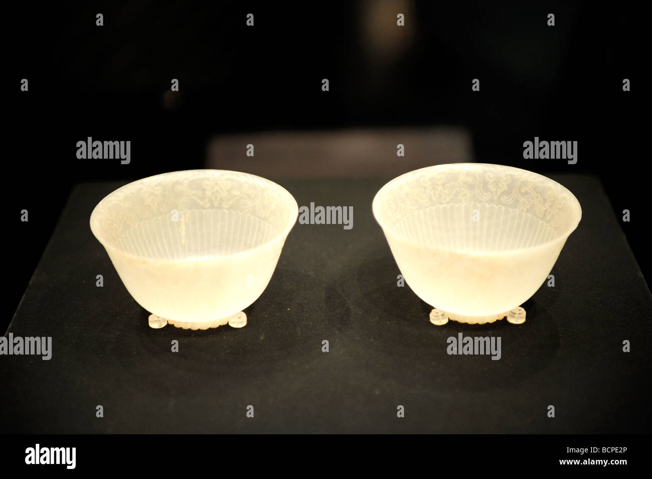 Two exquisite carved white jade bowls with chrysanthemum pattern from Qianlong period in Qing Dynasty, Capital Museum, Beijing, Stock Photo