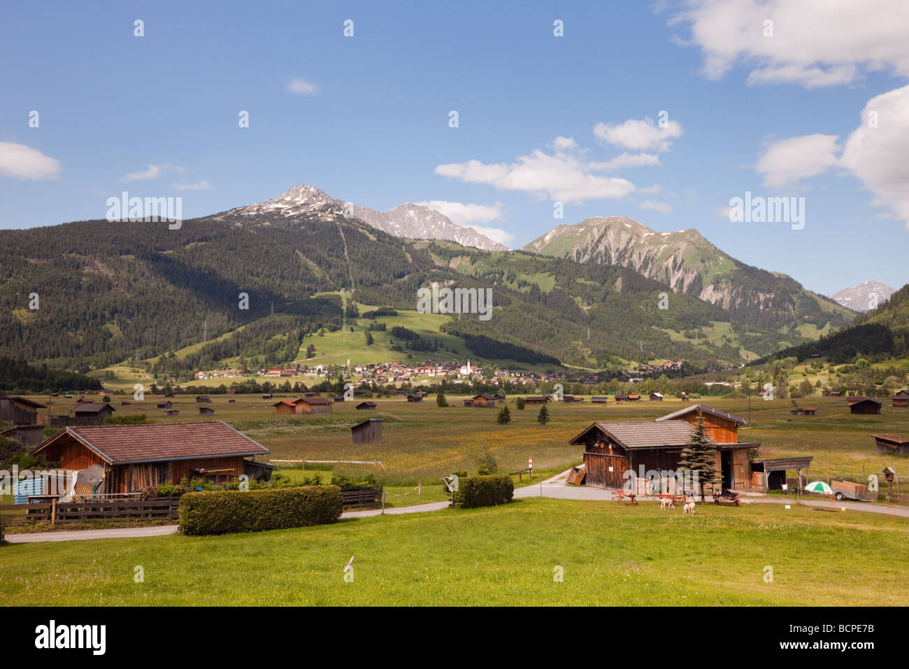 View across Alpine valley to Lermoos village in summer from Ehrwald ...