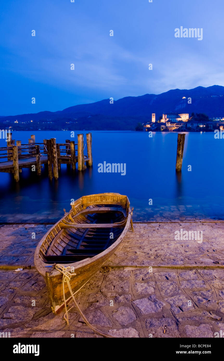 Boat at night on the shore of the Orta Lake Piemonte Italy Stock Photo