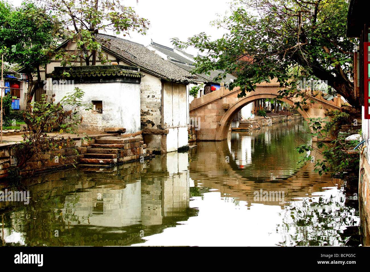 Narrow waterway and traditional riverside residence, Xitang Water Town ...