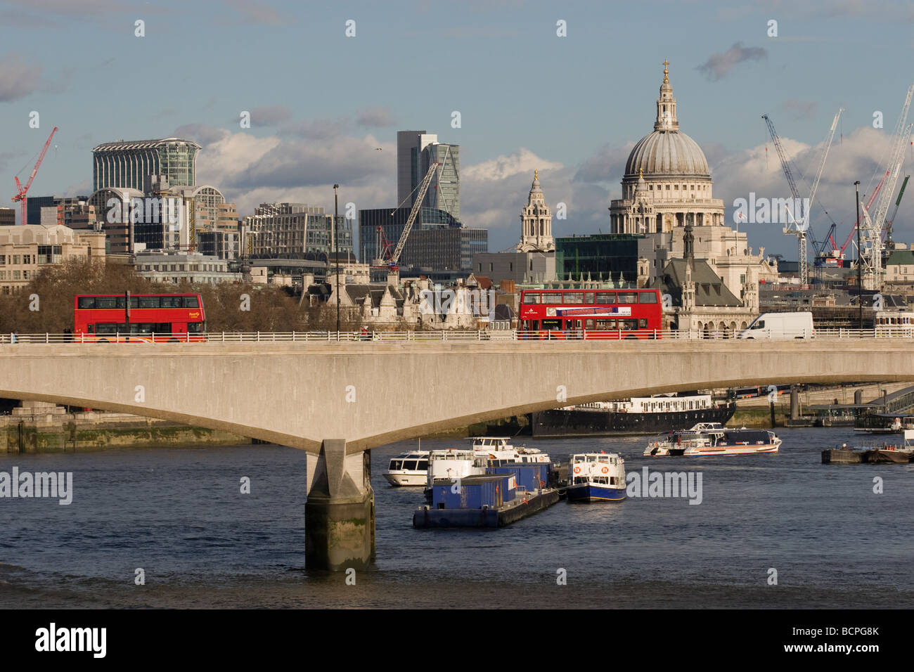 View of City of London and Saint Paul's Cathedral and London red Buses from Waterloo Bridge Stock Photo