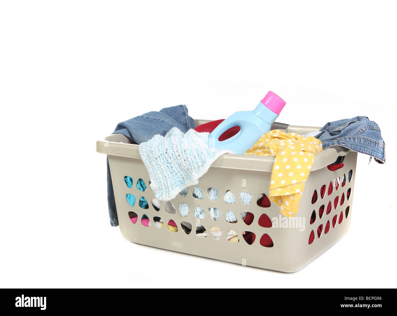 Basket Full of Dirty Laundry With Detergent Ready to Be Washed Stock