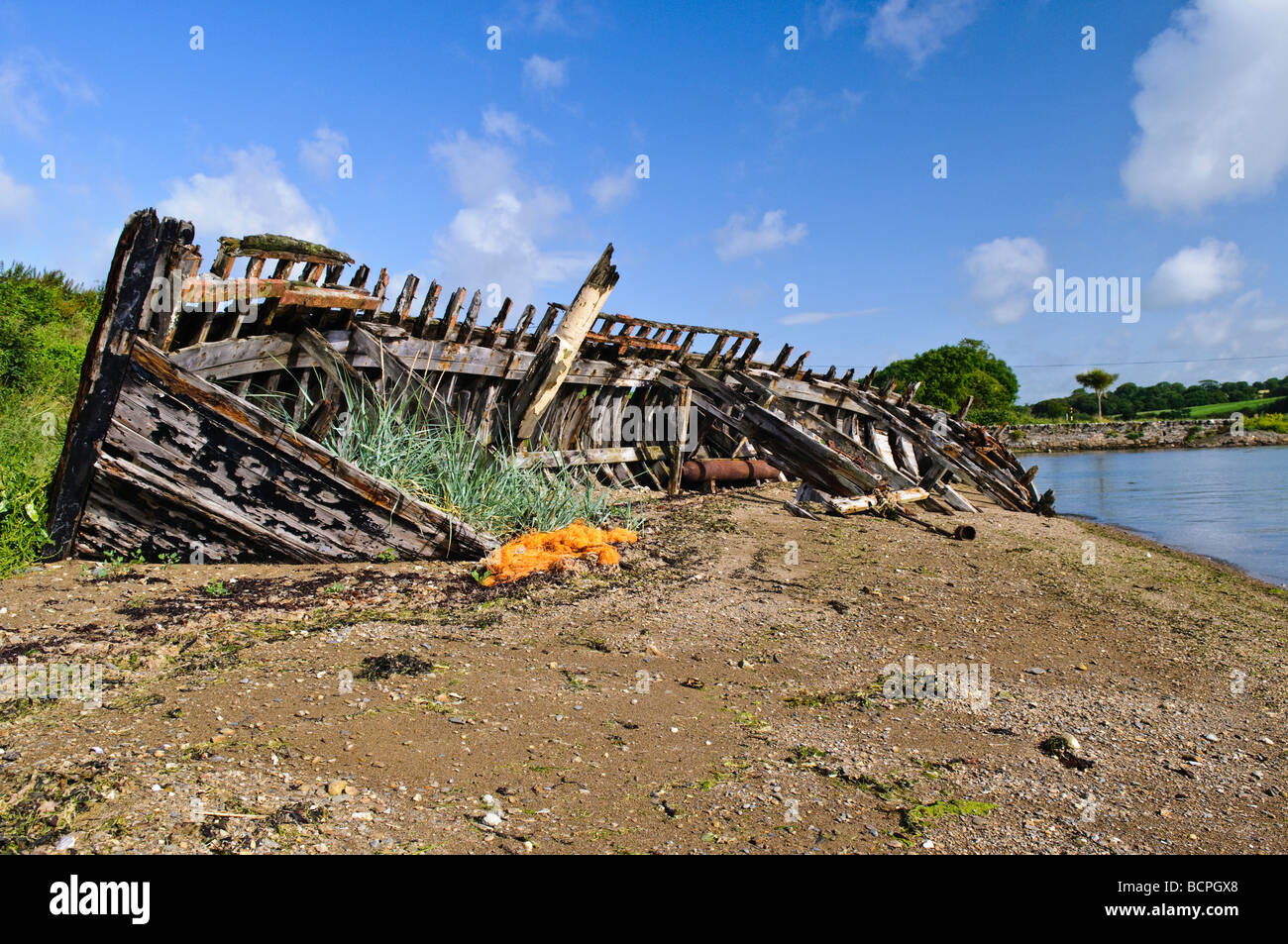 Shipwreck of a fishing boat on a beach in Wexford Ireland. Stock Photo