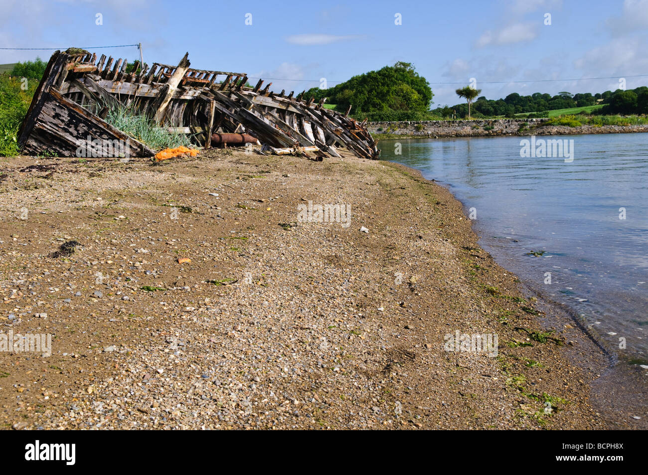 Shipwreck of a fishing boat on a beach in Wexford Ireland. Stock Photo