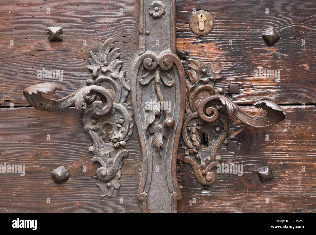 Metal iron handles on the timber of a house in the old town of Salzburg Austria Stock Photo