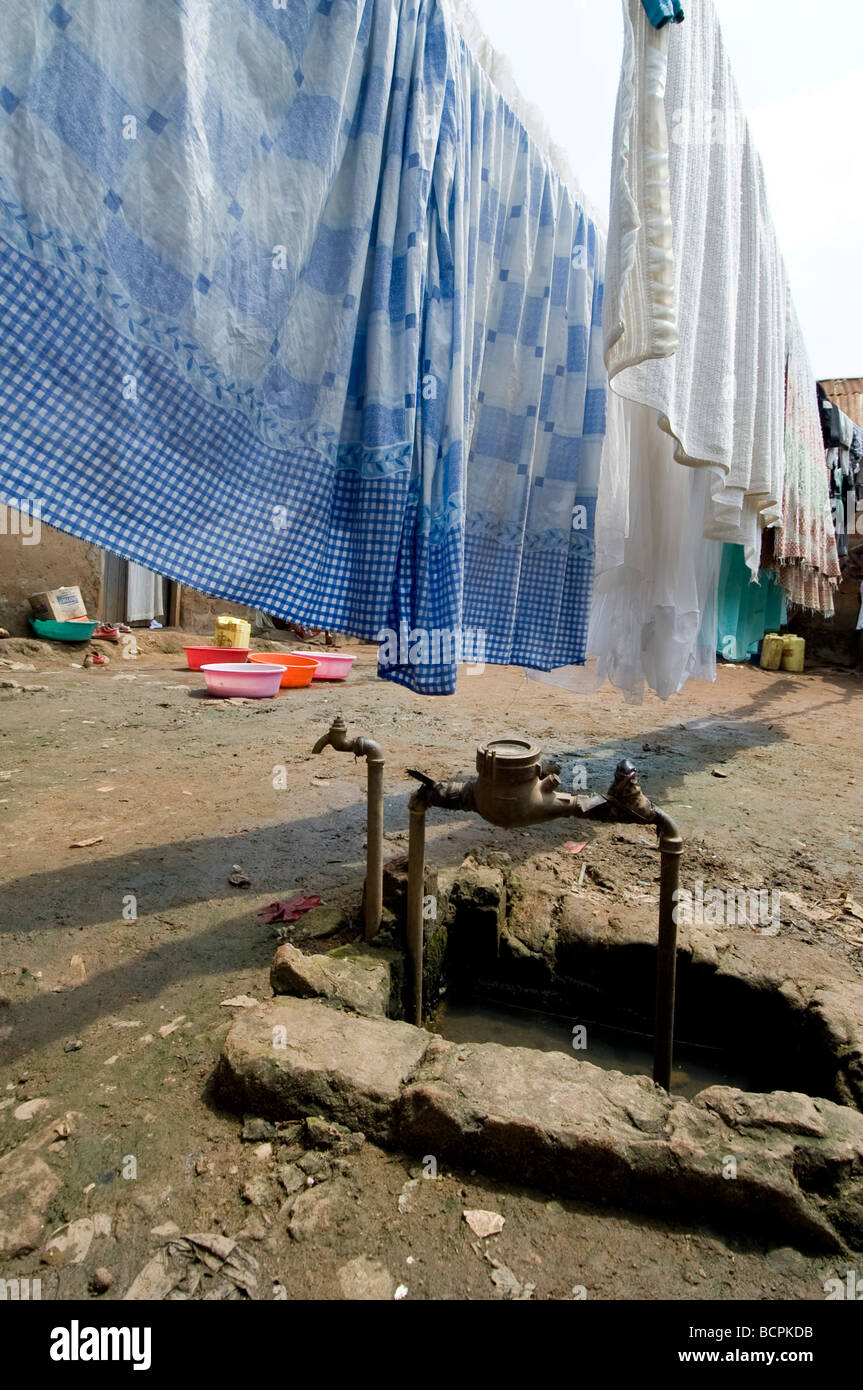 Metered water supply. Most people cannot afford this so use a contaminated spring. Kamwockya Kampala Uganda Stock Photo