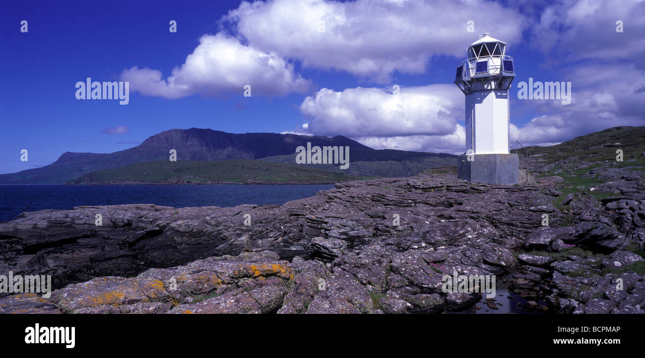 Rubha Cadail lighthouse at Rhue and Ben More Coigach, near Ullapool, Sutherland, Scotland Stock Photo