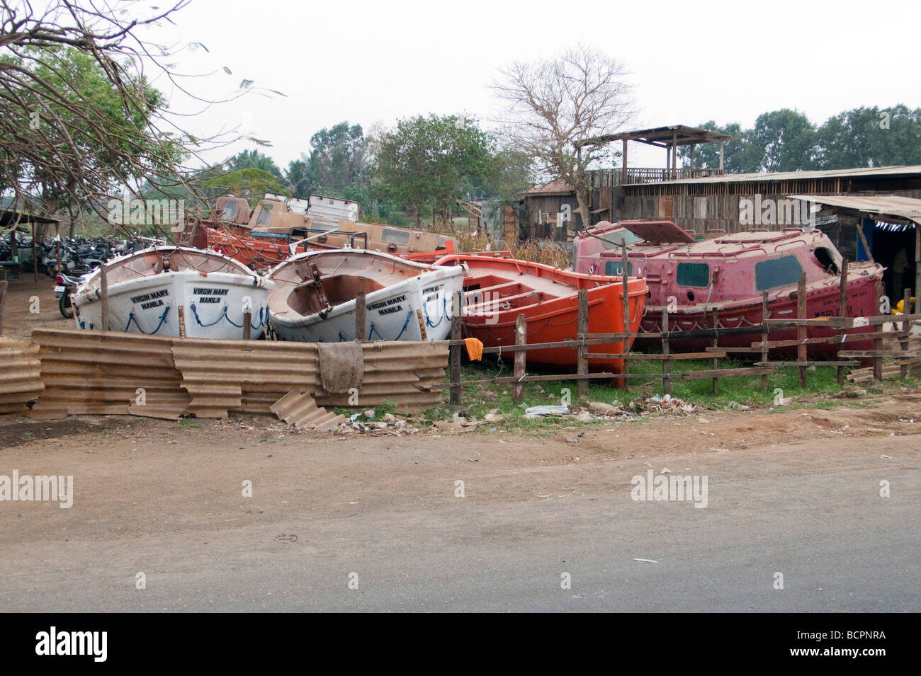 Lifeboats for sale ship breaking Alang Sosiya Recycling Yard Gujarat Gulf of Kambhat India Stock Photo
