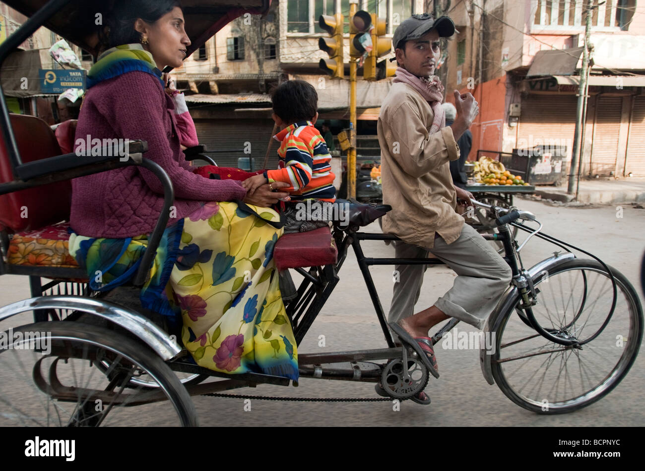 Woman and child ride in rickshaw Jaipur Rajasthan India Stock Photo