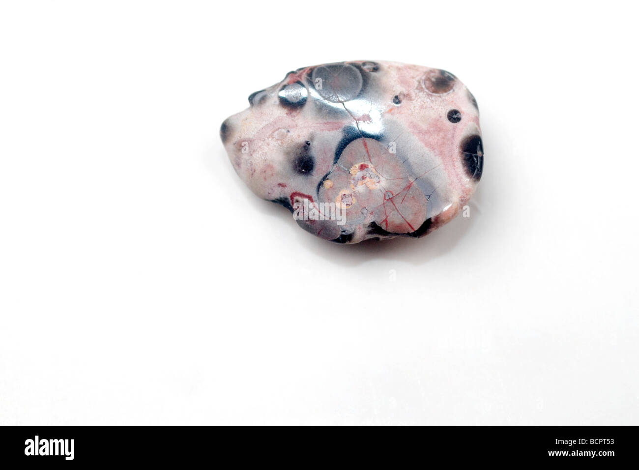 Cutout of a Leopard Skin gemstone on white background Stock Photo