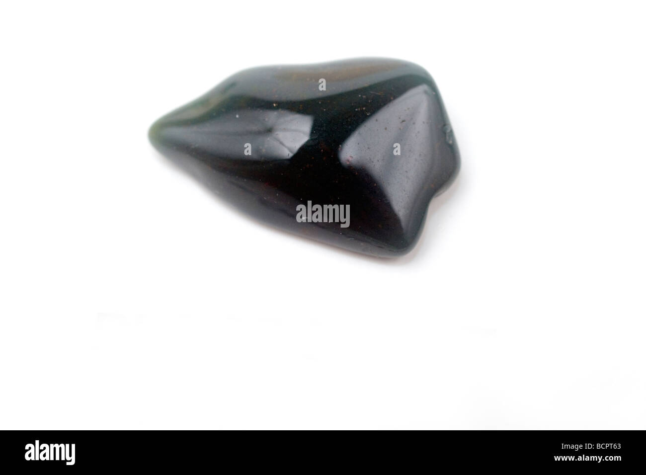 Cutout of a Bloodstone gemstone on white background Stock Photo