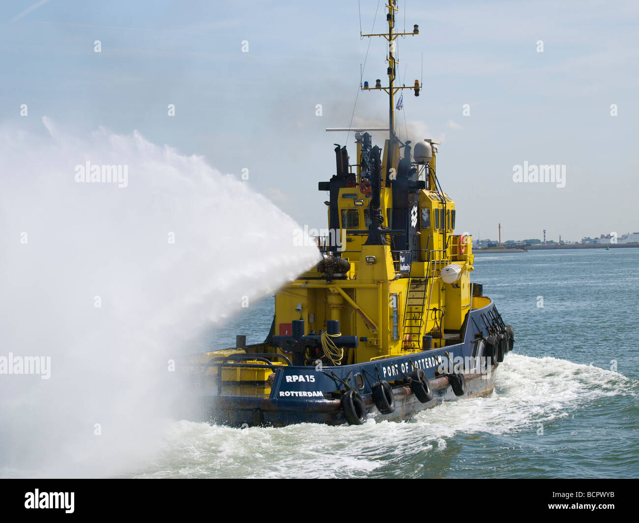 Fire fighting boat showing off the enormous power of it s water gun