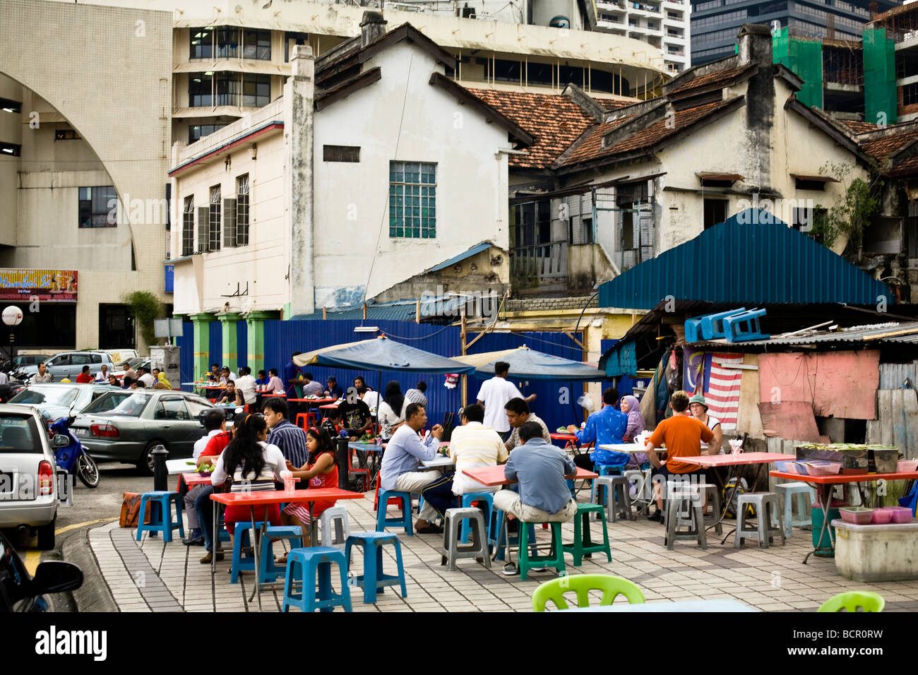 Locals and tourists have dinner at a popular food street in Kuala Lumpur, Malaysia. Stock Photo