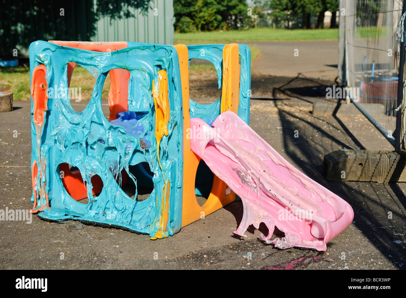 Children's slide melted by intense heat Stock Photo Alamy