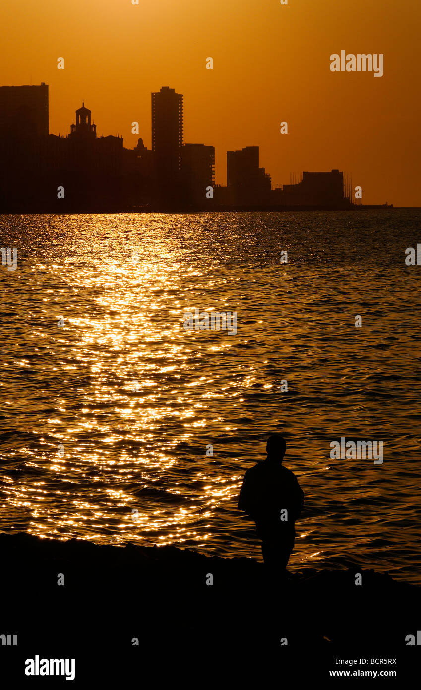 Havana sunset & lone figure, Cuba Stock Photo - Alamy