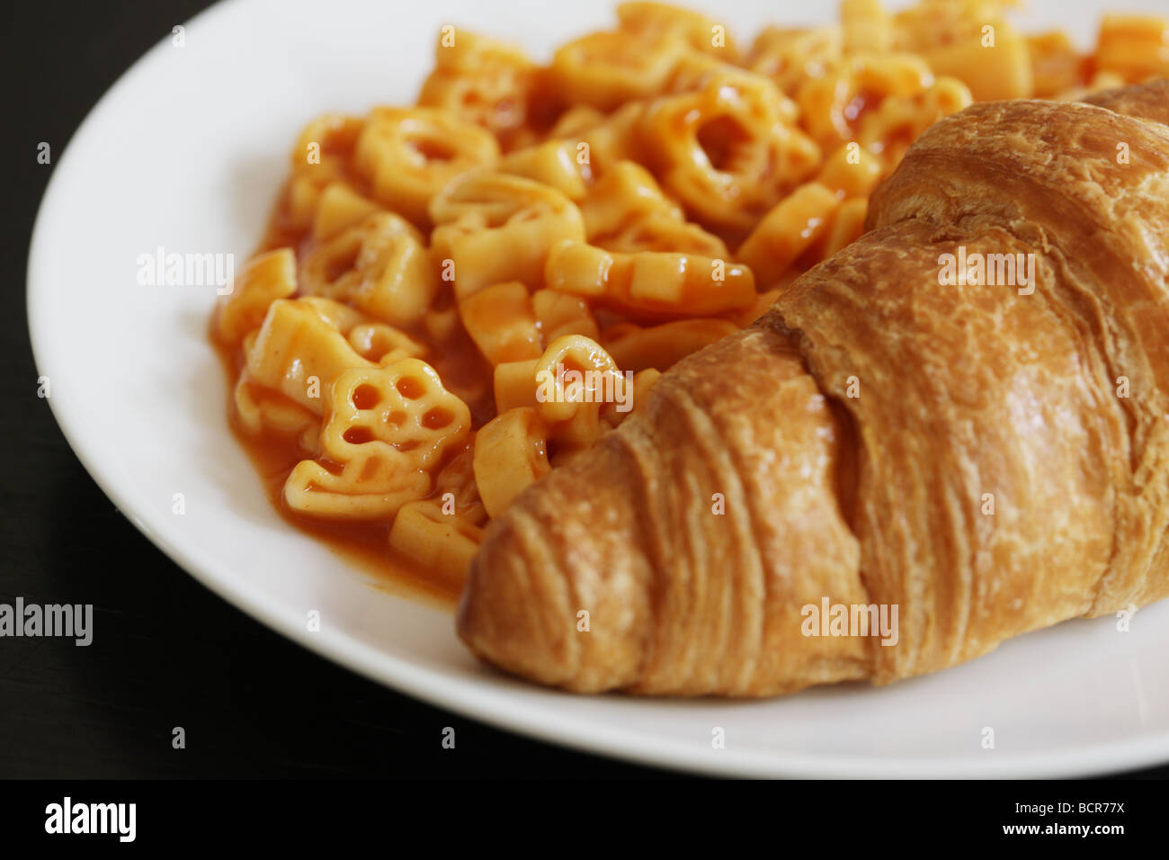 Croissant with Pasta Shapes Stock Photo