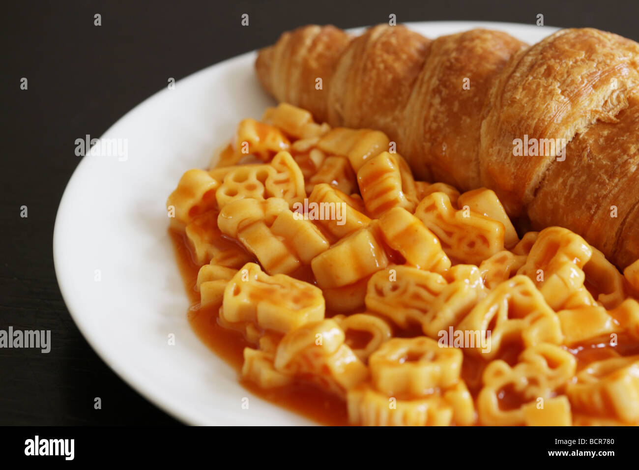 Croissant with Pasta Shapes Stock Photo