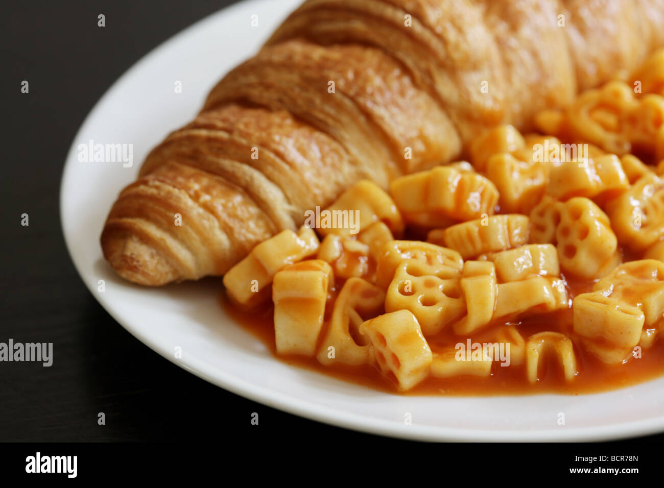 Croissant with Pasta Shapes Stock Photo